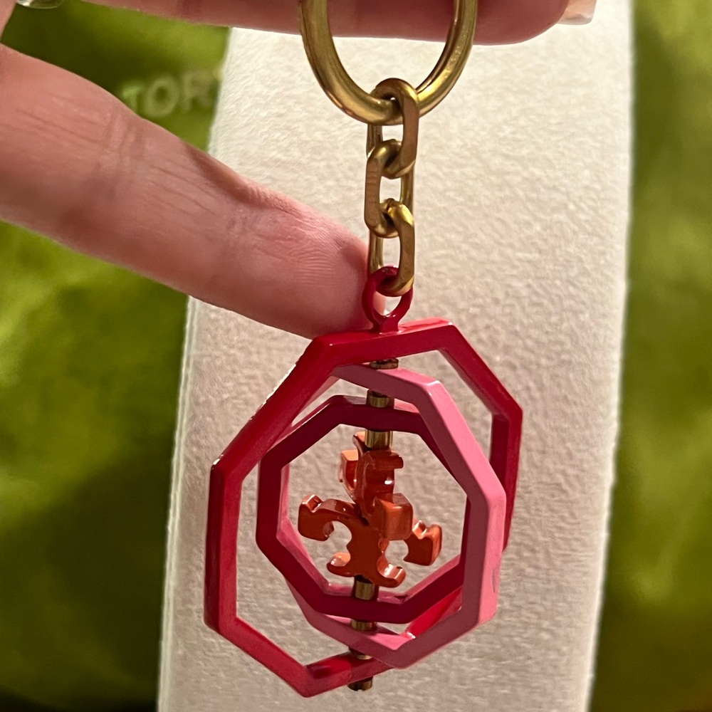 Tory Burch Rotating Geo Key Fob/bag charm in red and pink hues. - Picture 4 of 6